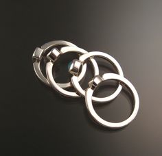 "Set of Four Sterling Silver rings with your choice of premium natural birthstones.(restrictions apply). Size and shape can vary (triangle, round, oval, and square). Stones are between 3.5 and 4.5mm. Four rings are about 8mm wide at the bottom and 12mm at the top. Specify ring size and birthstone preference in a \"note to seller\" at check-out. It is always best to send me a note before ordering to work out the details." Modern Stackable Birthstone Rings Round Cut, Modern Sterling Silver Stackable Rings With Tension Setting, Modern Sterling Silver Stackable Rings Round Cut, Modern Stackable Birthstone Rings, Modern White Gold Ring With Birthstone, Modern Birthstone Rings With Round Stone, Modern Rings With Round Birthstone, Modern Silver Three Stone Jewelry, Modern Sterling Silver Birthstone Ring