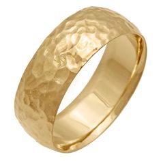 a gold wedding ring with textured surface