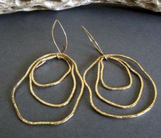 "Artisan handmade organic shape earrings. Each component is hand shaped so each will have it's own unique shape. The Details ∞ Artisan handmade jewelry ∞ 14k gold filled handmade textured drops ∞ 14k gold filled handmade ear hooks ∞ Approximate total length ~ 3\" ∞ Made to order Θ Allow up to 14 business days before shipment Θ ∞ Gift box included ∞ Made in the USA Pick up a matching pendant necklace here... https://www.etsy.com/listing/641990023/gold-boho-statement-necklace-large VISIT OUR SHOP: Modern Freeform Gold Jewelry, Hand Forged Freeform Elegant Jewelry, Artisan Freeform Gold Jewelry, Hammered Freeform Jewelry For Gifts, Hammered Freeform Jewelry As A Gift, Gold Freeform Earrings As Gift, Gold Freeform Earrings For Gift, Elegant Handmade Freeform Earrings, Texture Jewelry