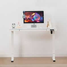 a computer monitor sitting on top of a white desk