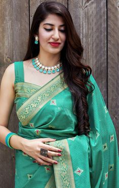 This Saree is Ready to Wear (With Fall and Pico Done). A designer saree in Sea Green Color. It has intricate design all over the saree. This saree is a suitable amalgamation of style and grace that is required from an ethnic wear. The saree is ideal for any formal gathering. The saree comes with an unstitched blouse of corresponding color and design as shown in the picture. Banarasi Silk Designer Sea Green Color Saree Fabric Type: Soft Banarasi SilkPrimary Colour: Sea GreenSecondary Colour(s): G Engagement Saree, Golden Saree, Sequence Blouse, Saree Petticoat, Full Sleeve Blouse, Sea Green Color, Sarees Silk, Lehenga Skirt, Banarasi Silk Saree