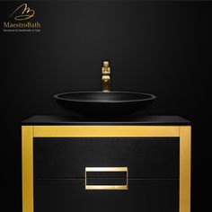 a black and gold bathroom vanity with a bowl sink on the top, in front of a dark background