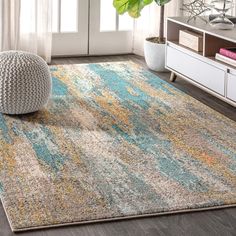 an area rug with various colors and patterns