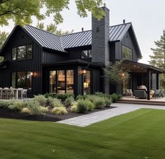 a large black house with lots of windows