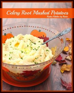 a bowl filled with mashed potatoes on top of a wooden table