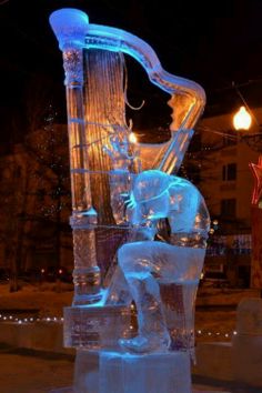 an ice sculpture with a man playing the harp