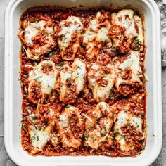 lasagna casserole in a white dish on a gray background with text overlay