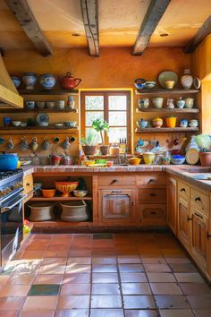 a kitchen filled with lots of pots and pans next to a stove top oven