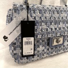 Gorgeous Nwt Karl Lagerfeld Agyness Convertible Crossbody Bag In Light Blue, White, And Silver Fabric; Light Blue Leather, And Silvertone Hardware! The Bag Reminds Us Of Karl Lagerfeld’s Time At The House Of Chanel! The Blue & White Tweed With That Shiny Silver Tone Chain Weaved Through With Blue Leather Screams Elegance, Sophistication, And Class. The Heavyweight Strap Can Be Worn As Either Shoulder Or Crossbody. The Interior Features A Satiny Brocade Of Lagerfeld’s Iconic Profile. Includes Kar Blue Formal Bags For Spring, Blue Shoulder Bag For Formal Occasions In Spring, Formal Blue Shoulder Bag For Spring, Karl Lagerfeld Bags, Convertible Crossbody Bag, Authentic Bags, White Tweed, Silver Fabric, Leather Handbags Crossbody