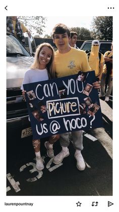 two people standing next to each other holding a sign that says can you picture us at hoo?