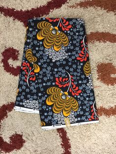 This black and gold African Fabric is high quality African print made from 100% cotton and it's 45 inches wide. It is used for making African Clothing, African quilts, & For Home decoration. FYI: Print is Double sided. The listing is for 1, 6 yards and Headwrap Each piece of fabric measures: 36in by 45in for 1 yard 216in by 45in for 6 yards 70in by 22in for Head wrap If you purchase more than one yard, you will receive one continuous piece. *If you require more than what I have listed, feel Sewing Kit Bag, African Headwrap, African Quilts, Clean And Press, African Prints, Ankara Fabric, Kit Bag, Tiger Stripes, Wax Print