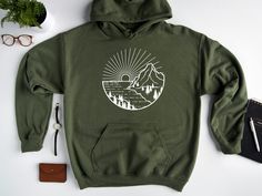 Who doesn't love the great outdoors? Who doesn't love spending time in nature? Who doesn't love hiking, camping, and mountain climbing?! Our hoodies are made for you. With stunning, outdoor-inspired graphics on the front, comfy fleece lining on the inside, and built-in snacks in the drawstring pocket that are sure to keep you energized when exploring our beautiful world. M A T E R I A L S → Gildan® Heavy Blend™ Adult Hooded Sweatshirt → 50% Cotton / 50% Polyester → Classic Fit → Fabric 271 g/m² Halloween Hoodies, Grandmother Granddaughter, Travel Hoodie, Nasa Hoodie, Camping Hoodie, Nursing Hoodie, Hiking Gifts, Halloween Nurse, Heart Sweatshirt