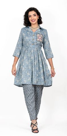 This luxurious cord-set features a printed shirt with a timeless, ornamental collar and a delicate tie-knot waist belt, accompanied by a pair of dhoti pants printed with a tasteful combination of patterns. Offered in four different sizes from M to XL About Pironah Discover Pironah, your go-to for Indo-Ethnic and Fusion Wear on Etsy! 🌟 From Silk Suits to Anarkalis, trendy Co-ord Sets, and many more, our curated collection blends tradition and contemporary style. Shop exclusively at https://www.p Elegant Printed Straight Kurta Set, Cotton Floral Print Sets For Navratri, Cotton Sets With Floral Print For Navratri, Elegant Cotton Sets With Block Print, Elegant Cotton Block Print Sets, Elegant Block Print Cotton Sets, Printed Cotton Sets For Navratri, Traditional Cotton Semi-formal Sets, Cotton Semi-formal Festive Sets