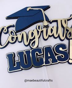 congratulations lucas sign with graduation cap and tassel on the top in blue and gold