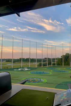 a golf course with many flags in the background