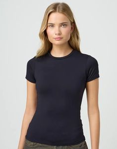 Sleek Fitted Tops For Everyday, Fitted Short Sleeve Basic T-shirt, Sporty Crew Neck T-shirt For Layering, Sleek Stretch Tops For Everyday, Sporty Stretch Tops With Shirttail Hem, Sporty Stretch Short Sleeve Crew Neck Top, Sleek Solid Color Everyday Tops, Sleek Everyday Solid Color Tops, Sleek Fitted Short Sleeve Tops