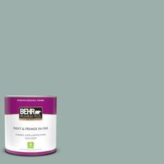 a can of behr paint and primer in one on a dark blue background