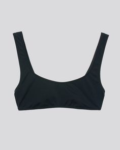 The Elle bikini top in black offers the perfect sporty look. This pull-over top has a low back and low scoop front that provides comfort and support. Pair with the matching Elle bikini bottom or any black bikini bottom silhouette from continuity. Solid & Striped, Sporty Look, Low Back, Black