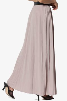 Step into elegance with our Flowy Maxi Pleated Skirt, a high-waisted, full-length wonder perfect for any event.Crafted from lightweight woven polyester, it offers a comfortable elastic waistband and a timeless pleated design.This versatile piece pairs seamlessly with fitted tops or casual tees, making it ideal for travel, business meetings, or weekend outings.Embrace the bohemian charm with this classic yet modern skirt, an essential for your all-season wardrobe.Women's Maxi Pleated Skirt: A hig Flowy A-line Pleated Maxi Skirt, Elegant Maxi-length Flowy Pleated Skirt, Non-stretch Pleated Wide-leg Maxi Skirt, Casual Full-length Pleated Maxi Skirt, Elegant Non-stretch Pleated Maxi Skirt, Modern Skirt, Pleated Maxi Skirt, Pleated Maxi, Casual Tee