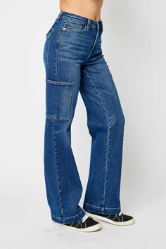 Expertly designed and crafted with a high waist and wide leg, the Judy Blue High Waist Wide Leg Cargo Jeans provide a stylish and comfortable fit. These jeans are made with high-quality materials for durability and feature practical cargo pockets for added functionality. Elevate your denim collection with these versatile and trendy jeans. Details:- High Waist- Wide Leg- Cargo Style with 6 Pockets Total- Lightly Stretchy Fabric Content:- 94% Cotton, 5% Polyester, 1% Spandex Blue Jean Romper, Paint Couture, Childrens Clothes Boys, Jean Romper, Candle Pedestal, Comfy Jeans, Judy Blue Jeans, Pant Length, Cargo Jeans