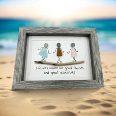 two people are walking on the beach in front of an old frame that says, life was meant for good friends and great adventures