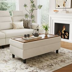 a living room filled with furniture and a fire place in front of a white fireplace