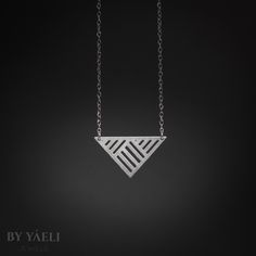 Triangle necklace - silver Geometric triangle with strips pattern pendant, its bound to be loved by the modern gal who loves fashion and minimalist design.    ★ Comes in our signature gift box, ready for gift giving.  ★ Available in Silver [Sterling silver chain & silver plated pendant]  ★ Pendant size : 1.30"x0.70" .  Thanks for shopping at ByYaeli♥  All images, texts & products are property of ByYaeli ©2017 Minimalist Silver Triangle Necklace, Minimalist Silver Geometric Jewelry, Minimalist Sterling Silver Triangle Necklace, Silver Triangle Jewelry For Everyday, Silver Triangle Necklace For Gift, Modern Silver Geometric Necklace, Minimalist Geometric Sterling Silver Necklace, Modern Triangle Jewelry For Gift, Geometric Silver Necklace For Gift