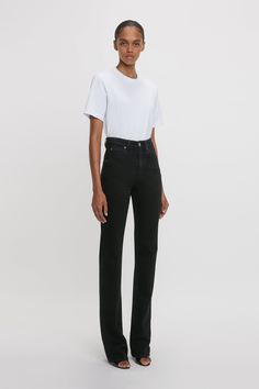 A favourite from the house’s denim library, the Julia Jean is reimagined in a Washed Black stretch denim exclusively for AW24. Characterised by a high waistline, straight leg and relaxed fit, the Julia is tailored from soft 100% cotton denim for a casual but sophisticated look. A silver branded denim shank button and copper branded rivets, tobacco topstitching and a branded leather patch at the back of the waist reflect the house’s consistent attention to detail. Styled with the Victoria T-Shirt Straight Leg Jeans Black, High Waisted Jean, Shank Button, Leather Patches, Black Stretch, Rivets, Victoria Beckham, Stretch Denim, Straight Leg Jeans