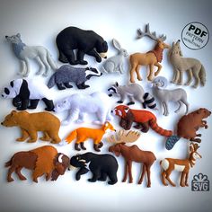 a bunch of different types of stuffed animals on a white surface with an ad logo in the background