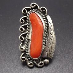 "VINTAGE NAVAJO RING DESCRIPTION: This classic ring features a lovely specimen of old red Mediterranean coral. The gemstone is secure in smooth bezel, on a foundation of heavy gauge vintage sterling silver. This ring will be a treasured addition to your collection of fine vintage Native American jewelry. MEASUREMENTS: Ring face measures 1 3/8\" x 5/8\" RING SIZE: 6 WEIGHT: 7.5 grams SIGNED: BJ STERLING: unmarked, verified sterling silver" Antique Sterling Silver Ring With Large Stone, Vintage Sterling Silver Ring With Polished Finish, Vintage Silver Ring With Large Stone, Vintage Jewelry With Large Stone In Open Ring, Vintage Sterling Silver Ring With Large Stone, Vintage Sterling Silver Rings With Large Stone, Collectible Red Engraved Ring, Vintage Red Jewelry Stamped 925, Vintage Collectible Rings With Large Stone