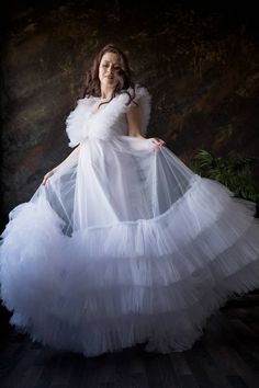 White Tulle Maternity Dress, Photoshoot Gown, White Sheer Dress Beautiful tiered tulle maternity dress with ruffles on top part. Dress is lined on bottom part. It will be a great dress for your maternity photoshoot. Dress is adjustable Fabric: tulle, cotton blend linen Length: floor length with train You can also order it as mother daughter matching set. Baby dress price - 90$ Dress is available in different colors. Contact me about color you wish. Additional cost in other color may be applied D White Floor-length Gown For Ceremony, White Ruffle Dress For Debutante Ball, White Ruffles Dress For Debutante Ball, White Tulle Floor-length Ball Gown, Ceremonial Tulle Ball Gown, White Floor-length Tulle Ball Gown, White Tulle Ball Gown For Baptism, White Tulle Baptism Dress With Ruffles, Wedding Gown With Attached Cancan In Tulle