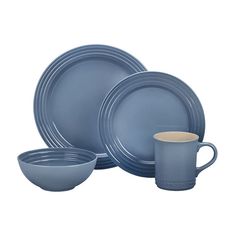 blue dinnerware set with cups and saucers