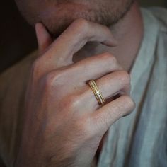 a man wearing a wedding band and ring