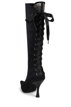 Victorian-inspired knee-high boot with lace-up detailing Fits true to size Measurements taken from size 7 3.75" Heel, 0.25" Platform 14" Shaft, 14" Leg Opening Fabric Upper, Leather/ Fabric Lining, Synthetic Sole Zipper closure Magnolia House, Victorian Boots, Knee High Heels, Pink Satin, Leather Fabric, Black Satin, Knee High Boots, Black Lace, Magnolia