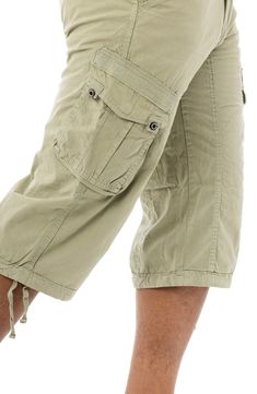 Style an on-trend look in cargo shorts crafted from breathable cotton for comfort during casual outings. 18" inseam; 10" front rise (size 32) Zip fly with button closure 100% cotton Machine wash, tumble dry
 Imported Model stats: 6'1" height, 32" waist. Model is wearing size 32. Knee-length Shorts With Pockets For Outdoor Activities, Khaki Knee-length Shorts With Side Pockets, Knee-length Capris With Pockets, Khaki Bermuda Bottoms For Outdoor, Bermuda Cargo Pants With Utility Style, Bermuda Shorts With Side Pockets For Outdoor Activities, Bermuda Shorts With Side Pockets For Outdoor, Outdoor Knee-length Cargo Shorts, Casual Cargo Capri Pants With Pockets