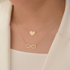 Express your love with our Handmade Heart Necklace crafted in 18K solid gold. This dainty heart pendant is the perfect gift for her, suitable for special occasions such as Valentine's Day, birthdays, and anniversaries.  heart size: 8mm* 8 mm  chain length: about  42 centimeters Material: 14k solid gold and also 10k and 18k gold Style: Minimalism Embrace minimalism with our elegant heart pendant that adds a touch of charm to any outfit. This timeless piece is designed to be cherished and worn every day. Customize your necklace by choosing your desired chain length at checkout. We include a resizable jump ring in the chain, allowing you to adjust it between 40 and 45 millimeters (16 and 17 inches) for the perfect fit. All our items come in an organza bag, making them ideal for gift-giving. I Minimalist Infinity Necklace For Valentine's Day, Mother's Day Double Heart Gold Plated Necklace, Gold Plated Double Heart Necklace For Mother's Day, Elegant Heart Charm Necklace As Gift, Heart Charm Infinity Necklace For Valentine's Day, Gold Necklaces For Valentine's Day Anniversary Gift, Infinity Heart Charm Necklace For Valentine's Day, Elegant Heart-shaped Charm Necklace For Gift, Heart-shaped Gold Necklace Gift Idea