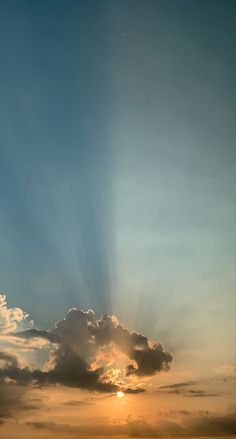 the sun is shining through clouds in the sky