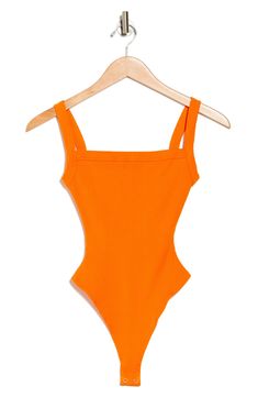 A square-neck bodysuit made from softly ribbed fabric has a shapewear-inspired silhouette for a body-hugging fit. Bottom snap closure Square neck Fixed straps 86% rayon, 14% spandex Hand wash, line dry Imported Fitted Ribbed One-piece Bodysuit, Stretch Ribbed One-piece Bodysuit, Fitted Solid Ribbed Swimwear, Solid Ribbed Fitted Swimwear, Fitted Ribbed Sleeveless Swimwear, Solid Spring Bodysuit With Seamless Construction, Solid Seamless Spring Bodysuit, Spring Seamless Solid Bodysuit, Spring Solid Color Seamless Bodysuit