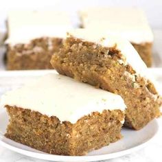 two pieces of carrot cake on a white plate