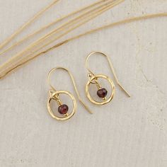 This extremely sweet pair of Small Red Garnet Circle Earrings are handcrafted for you with great care. The earring is lightweight, simple, and pretty. They are perfect for everyday wear and are a great January birthday gift! MATERIALS AND SIZE  ◆ Metal - 925 Sterling Silver, 925 Sterling Silver. ◆ Earrings measure approx. 0.75 inches / 19 mm from the top of the ear wire ◆ All earrings with French ear wires come with silicone ear backs for extra protection. ◆ Because I am using natural stones, th Fine Jewelry 14k Gold Filled Round Earrings, 14k Gold Filled Round Fine Jewelry Earrings, Garnet Gemstone Drop Earrings, Adjustable Round Fine Jewelry Earrings, Garnet Drop Earrings As Gift, Garnet Drop Earrings With Ear Wire, 14k Gold Filled Round Earrings For Gift, Brass Fine Jewelry Earrings As Gift, Fine Jewelry Brass Earrings For Gift