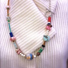 Pink Rhodochrosite, pink opal, raw pale blue stone, freshwater pearls, citrine, pink coral, lapis lazuli, sterling silver and other hidden treasures.  To me the focal point of this piece is a vintage, hand painted FROM THE INSIDE, Chinese glass bead.  How do they do that?  The chain is sterling with a beautiful woodland toggle clasp. Painted Beads, Pink Rhodochrosite, Ancient Roman Glass, Oval Necklace, Silver Bead Necklace, Hippie Necklace, Reverse Painted, Pink Coral, Coral Beads