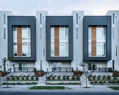 two story apartment building with multiple balconies and windows