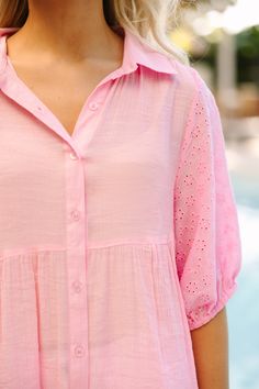 This button down tunic is so feminine and cute! The casual fit makes it so easy to style and wear this spring and summer. The eyelet detailing is so classy too! Collared neckline Button down front closure Short bubble sleeves Eyelet detailing No stretch Poppy is wearing the small.