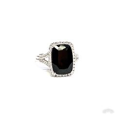 13mm x 9mm faceted black onyx prong set in the center of the ring. Round diamonds set around the onyx and down the sides of the ring. 4.5 grams 14k white gold. Size 7 but can be resized. Black Diamond Ring With Accent Stones For Formal Occasions, Classic Black Rings With Accent Stones, Elegant Onyx Diamond Ring For Formal Occasions, Formal Onyx Diamond Ring Fine Jewelry, Formal Black Diamond Ring With Accent Stones, Formal Onyx Diamond Ring In Fine Jewelry Style, Modern Black Rings For Evening, Formal Onyx Gemstone Rings, Classic Black Jewelry With Accent Stones