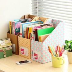 an office desk with books, papers and pencils