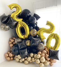 balloons are stacked on top of each other in the shape of numbers