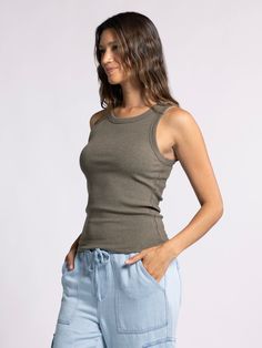 Style Description: Forever timeless in the EDLIN TANK! Crafted in a soft ribbed fabrication, this tank is a wear-everywhere kind of essential. Sleeveless tank Crew neckline Measurements for a size small: Length: 23" Chest: 14" Waist: 13" Fabric Content/Care: 48% Cotton 48% Modal 4% Spandex Machine Wash ColdImport Casual Seamless Camisole For Everyday, Casual Everyday Seamless Camisole, Ribbed Tank Top For Everyday Spring Wear, Casual Ribbed Cotton Tank Top, Casual Cotton Ribbed Tank Top, Ribbed Tank Top For Everyday Wear, Casual Solid Seamless Tank Top, Casual Seamless Solid Tank Top, Casual Seamless Solid Color Tank Top