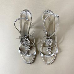 Vintage silver and crystal strappy heeled sandals designed by Giuseppe Zanotti, incredibly rare and highly sought after collection. In a silver leather finish with brand signature stitched into the footbeds. One of our favourite pairs to date ♥ Period 2000s Measurements UK 8 | EU 41 | US 10 Condition: In good used condition with some wear in line with age, photographed and reflected in price. Made in Italy 💌 Where possible, items have been laid flat and measured in inches, prior to listing. Some original size labels will also be listed in the product descriptions, however vintage sizing can vary from the standardised clothing sizes of today, and vintage shoes in particular can fit small, dependant on the style. We recommend to check the measurements carefully, and compare to an item you o Crystal Heels, Womens Pumps, Leather Finish, Strappy Sandals Heels, Designer Sandals, Vintage Shoes, Heeled Sandals, Strappy Heels, Womens Heels