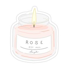 a pink candle sticker with the word rose on it and a white label that says,