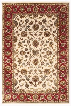 a red and white rug with an ornate design on the bottom, in front of a white background